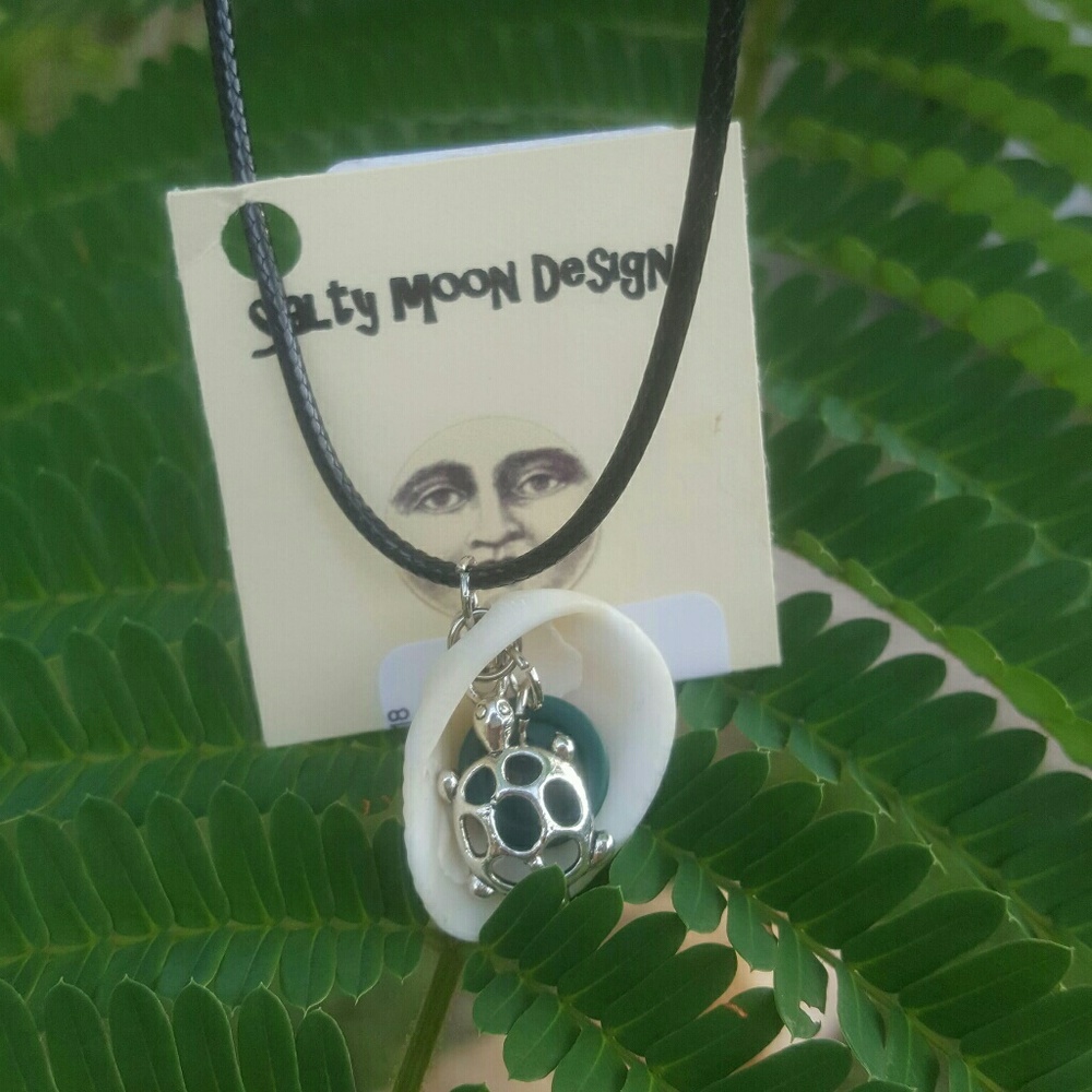 * Natural shell necklace with turtle charm.
